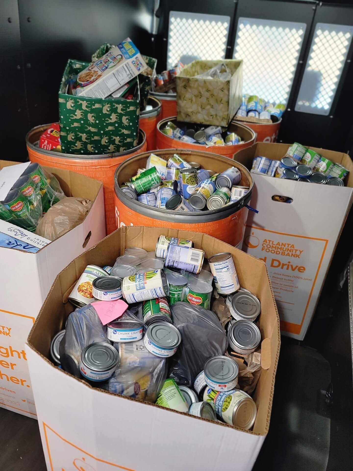Boxes, bins, and bags of canned and dried goods donated to the holiday food drive this december. 